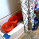In this Feb. 22, 2021 photo, Doris Devine in Jackson, Mississippi, stores containers with potable water provided by Jackson councilman and state Rep. De’Keither Stamps in her tub. With no water pressure, the water will be used to flush the toilet.
